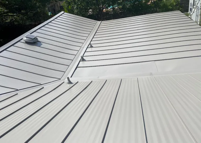 Solar attic fan installed on a metal roof for Roof Ventilation in Sandusky